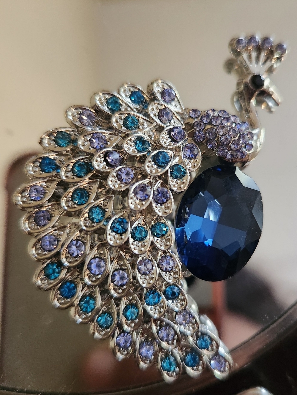 Elegant Peacock Brooch with Blue and Purple Crystals